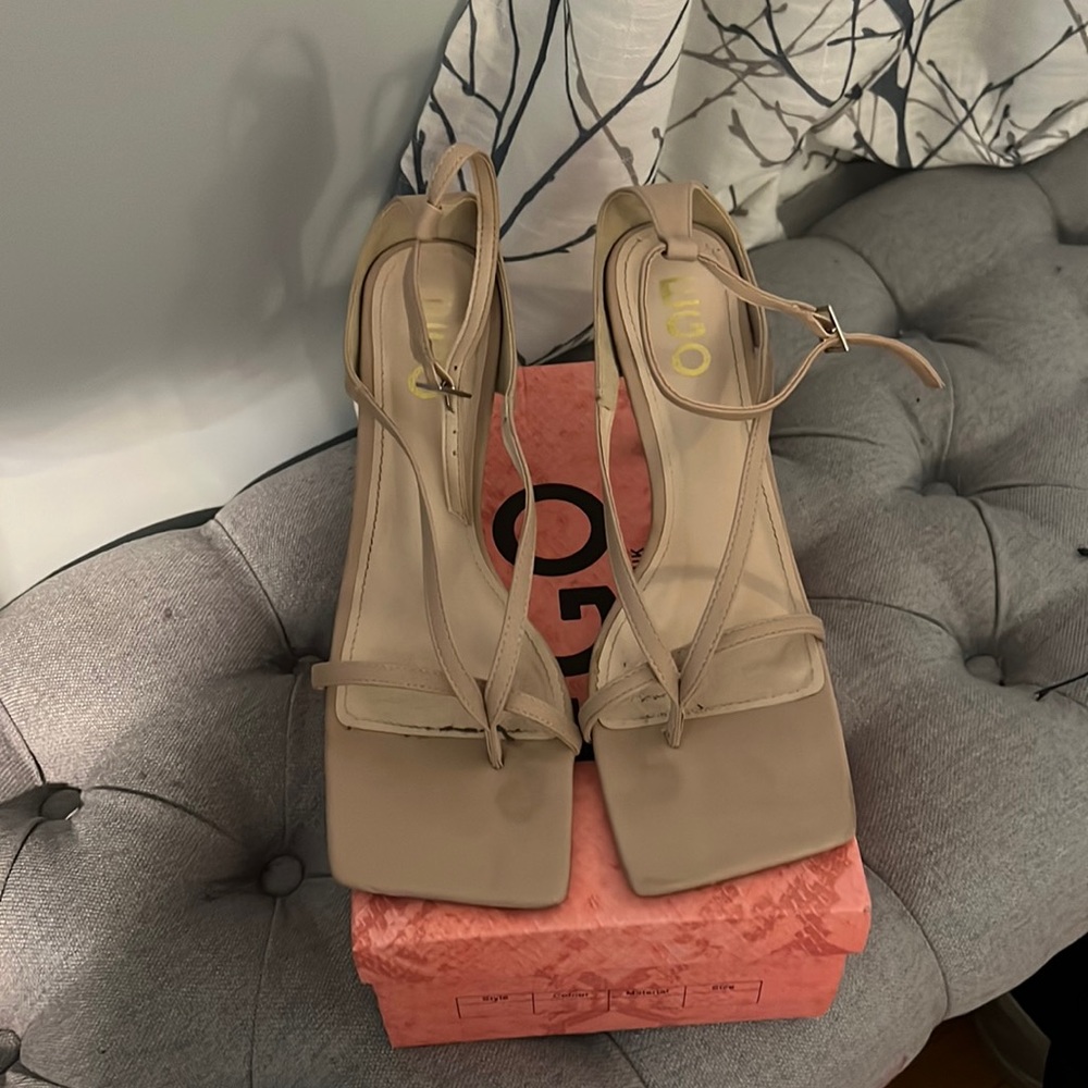 Nude color straps sandals.